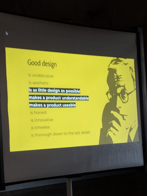 yellow slide with black text and cut out image of Dieter Rams: good design is unobtrusice, is aesthetic, (start highlighted text)is as little design as possible, makes a product understandable, makes a product useable (end of highlighted text), is honest, is innovative, is timeless, is thorough down to the last detail. Quote by Dieter Rams.